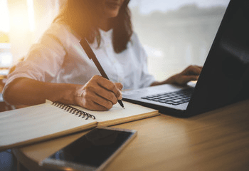 Writing on Laptop